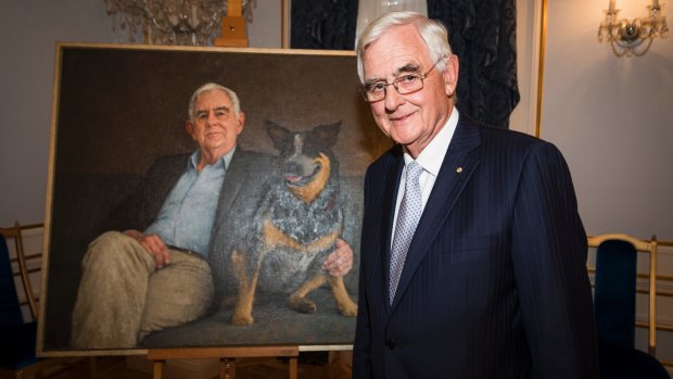 Terry Snow with his portrait.