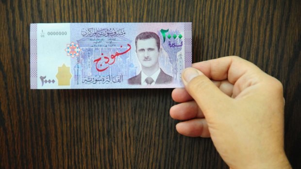 The new 2000 Syrian Lira notes are the first time the face of President Bashar Assad appears on the country's currency.