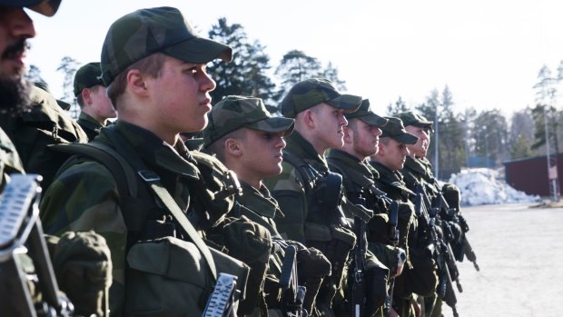Young Swedish army recruits during an inspection last year.