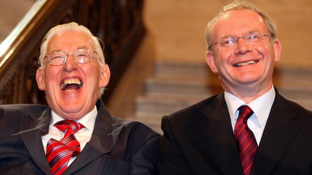 Northern Ireland's first minister Ian Paisley and deputy first minister Martin McGuinness smile after being sworn in  at Stormont in May 2007.