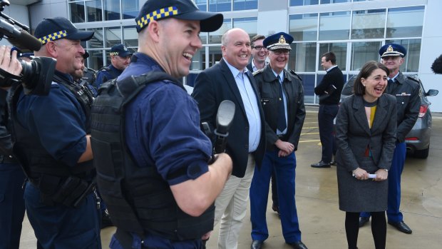 Corrections Minister David Elliott, centre, Corrections Commissioner Peter Severin  and Premier Gladys Berejiklian with prison staff on Sunday.