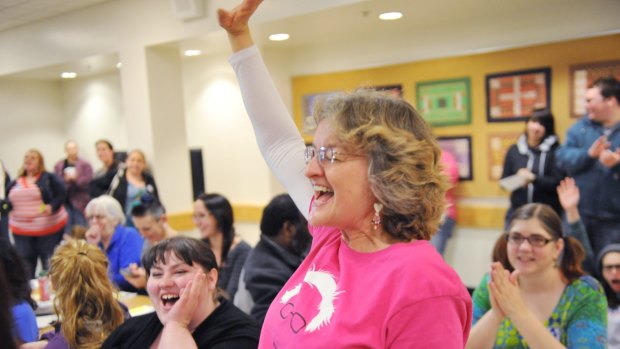 Bernie Sanders supporter Maryellen Lambert reacts at the Democratic party caucus in Anchorage, Alaska.