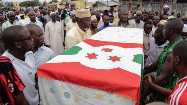 Slain Burundian opposition figure Zedi Feruzi is buried in the national flag in May.