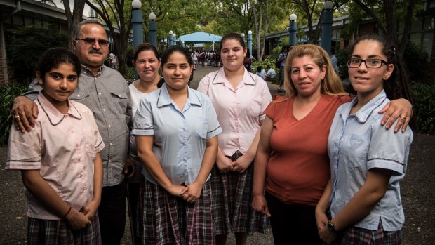 Refugees students and parents at Mary Mackillop College, Wakeley. From left: Lara Al-Khafaji, Saeed Al-Khafaji, Hamsa Al-Duhesi, Tara Al-Khafaji, Sarah ghareeb, Rita Dawod and her daughter Jouliana Alnawaqkil.