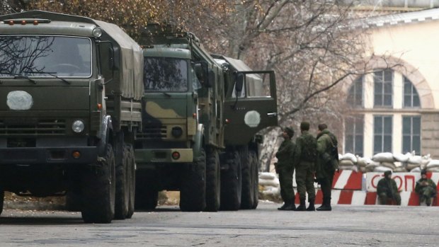 Unidentified military trucks near a checkpoint  in Donetsk.