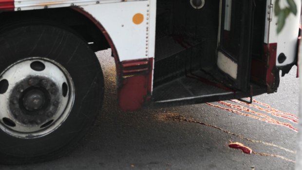 Blood is seen at a crime scene after a bus driver was killed by suspected gang members on Monday. 