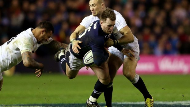 Going nowhere: Stuart Hogg of Scotland is tackled by Courtney Lawes (L) and Mike Brown (R) of England last weekend.