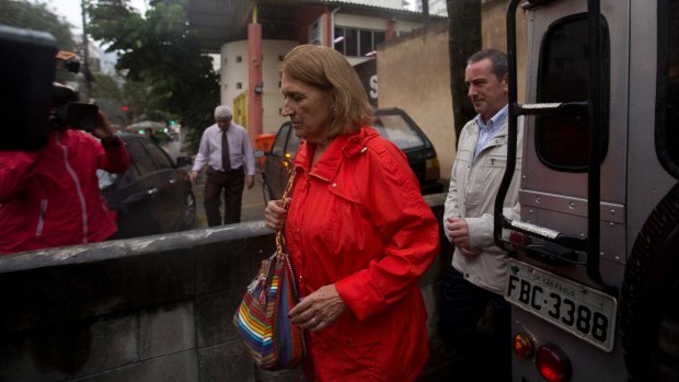 Rosa Margarita Martinez, the sister-in-law of Spanish tourist Maria Esperanza Jimenez Ruiz who was killed by military police, leaves a police station in Rio.
