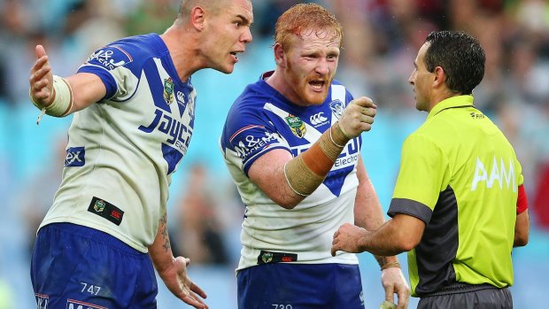 The flashpoint: David Klemmer and James Graham of the Bulldogs confront Gerard Sutton over the controversial penalty call.
