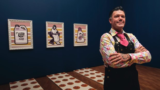 Blak Douglas with his work Domestic Violets, 2016, part of the the National Gallery of Australia's Defying Empire: the Third National Indigenous Art Triennial.