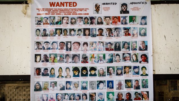 A poster of wanted terrorists in the Marawi area.  