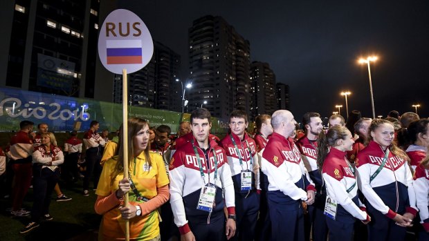Tainted games: Russia athletes attend their welcome ceremony at the athletes village in Rio.