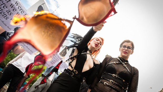 Burn baby burn: Chanelle Rodgers and Tori Bellentina burn bras from former Honey Birdette workers at a protest late last year.