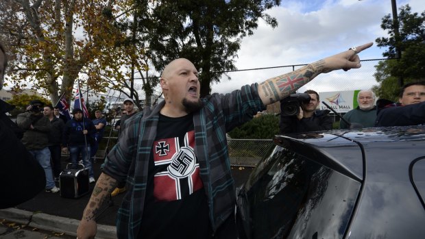 Glenn Anderson shouts at a Muslim woman at an anti-Islam rally in May 2015.