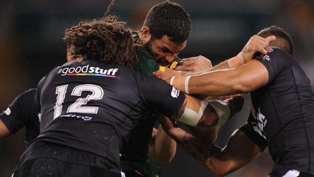 Off night: Greg Inglis goes into contact.