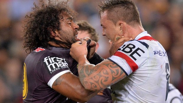 Running battle: Sam Thaiday of the Broncos and Jared Waerea-Hargreaves of the Roosters face off on Friday night.