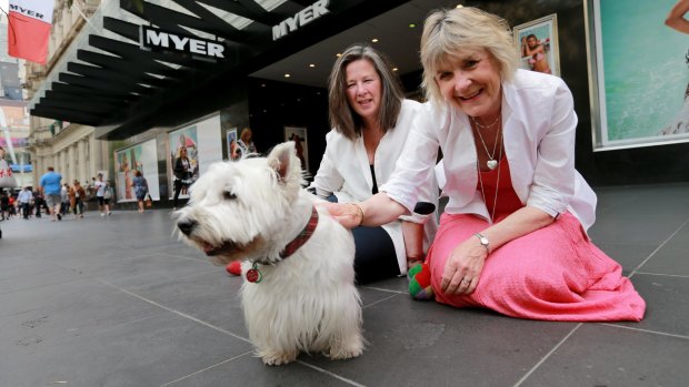 Robin Cowcher (left) and Corinne Fenton await the unveiling with dog Harry.