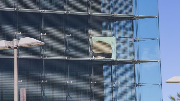 A broken window at the ASIO headquarters last year.