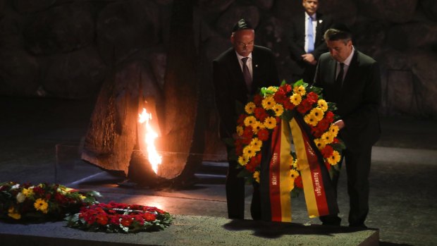 German Foreign Minister Sigmar Gabriel, right, lays a wreath at the Yad Vashem Holocaust memorial in Jerusalem earlier this week.