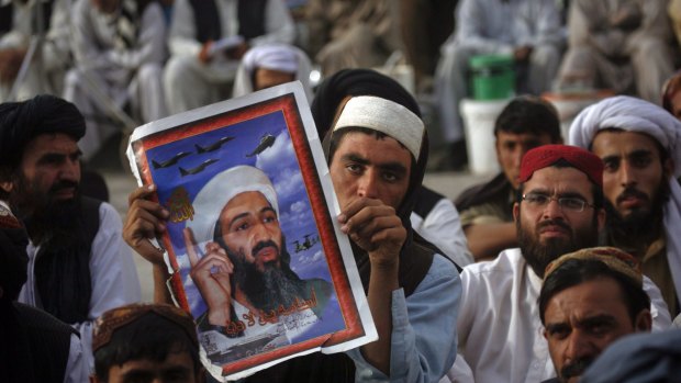 A supporter of Pakistan's Islamist JUI party holds an image of Osama Bin Laden in Quetta in May 2012, a year after his death.