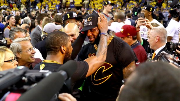 Dynamic duo: LeBron James and Kyrie Irving celebrate after defeating the Golden State Warriors 93-89 in Game 7.