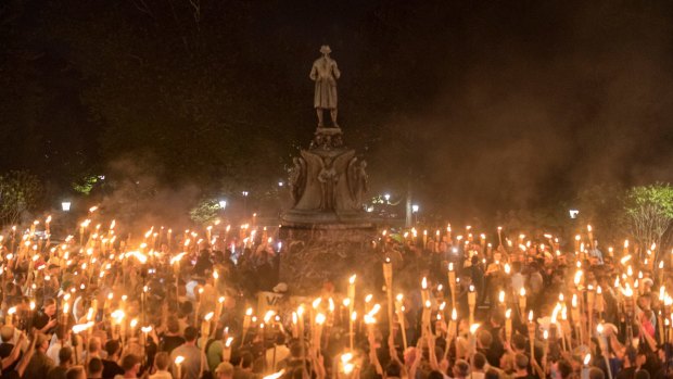 Torch-bearing white nationalists rally around a statue in Charlottesville.