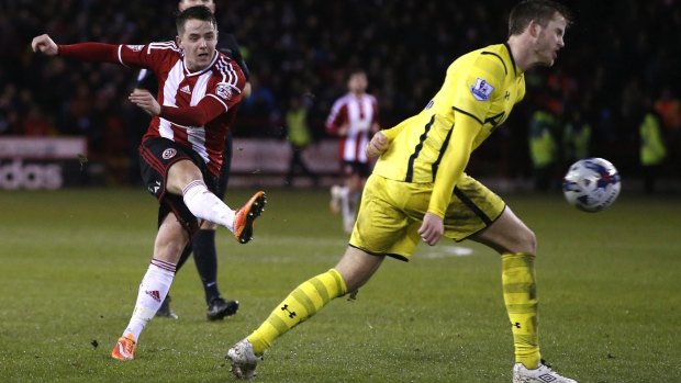 Sheffield United's Marc McNulty shoots at a goal.