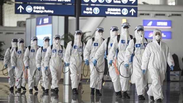 Workers prepare to disinfect Wuhan Tianhe International Airport in China earlier this month. New biosecurity measures could require Australian airports to greatly increase cleaning levels.