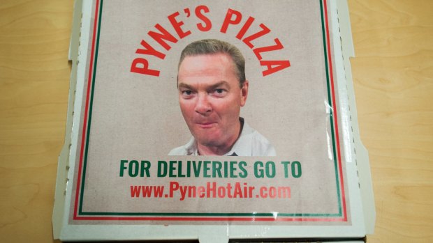 Minister for Industry Christopher Pyne's face on an an empty pizza box.