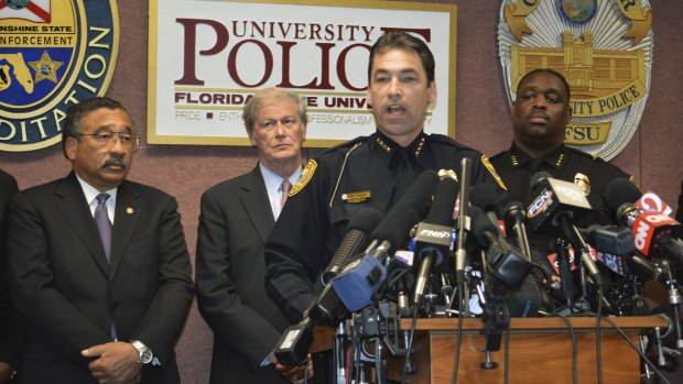 Tallahassee Police Chief Michael DeLeo, front, speaks during a news conference with Mayor John Marks (L to R), Florida State University president John Thrasher and campus police Chief David Perry. 