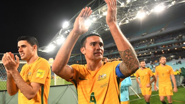 Australia's Tim Cahill (centre) and Tomas Rogic (left) applaud the crowd after their win over Syria at ANZ Stadium in October.