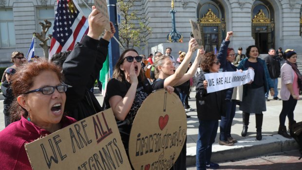 Demonstrators in support of the national "day without immigrants" protest outside City Hall in San Francisco.