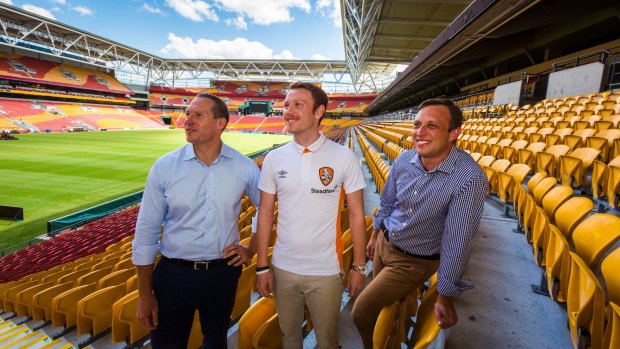 Minister for Sport Mick de Brenni, Roar player Corey Brown and member for Mt Coot-tha Steven Miles at the announcement of new screens that will be installed at Suncorp Stadium and The Gabba in 2017.