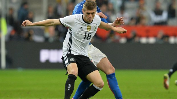 Germany's Toni Kroos protects the ball in Munich.
