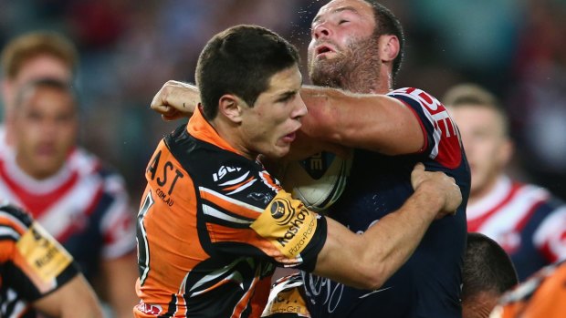 Full steam ahead: Boyd Cordner goes into contact with Mitchell Moses.