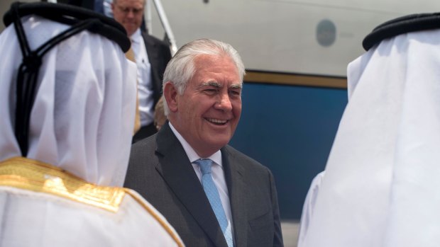 Qatari Ministry of Foreign Affairs officials welcome US Secretary of State Rex Tillerson to Doha on Tuesday.