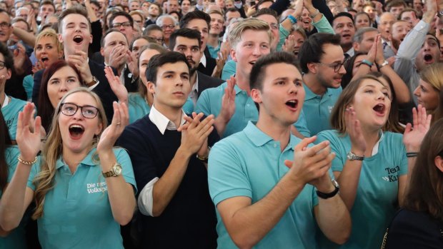 Supporters of Austrian People's Party celebrate  in Vienna after the first exit polls were published.