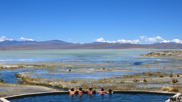 Tourists relax in the thermal pools in the Bolivian Altiplano.