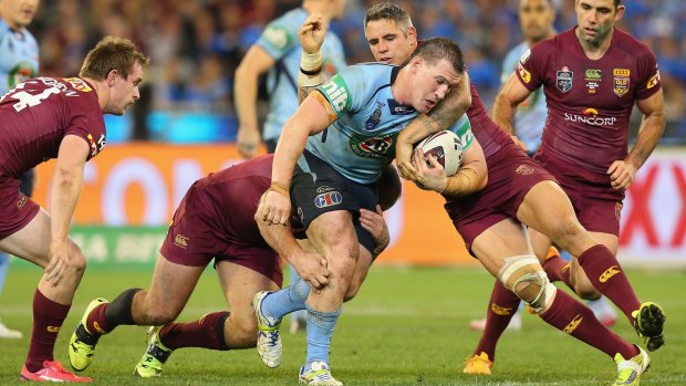 Punishment: Paul Gallen is tackled by Corey Parker at the MCG on Wednesday. 