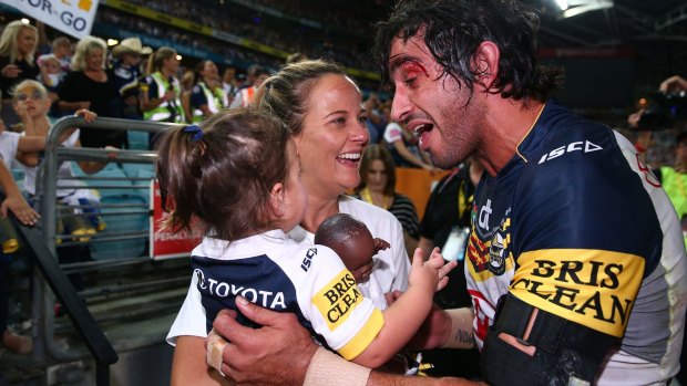 Fitting reward: Johnathan Thurston celebrates victory with his fiancee Samantha Lynch and daughter Frankie. 