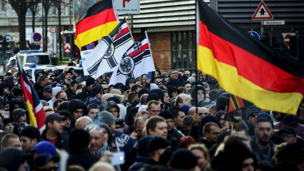Supporters of  right-wing groups gather in Cologne to protest against the New Year's Eve sex attacks.