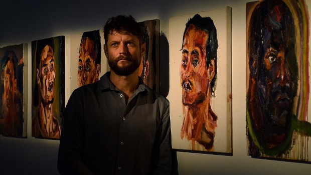 Ben Quilty with some of his friend Myuran Sukumaran's paintings.