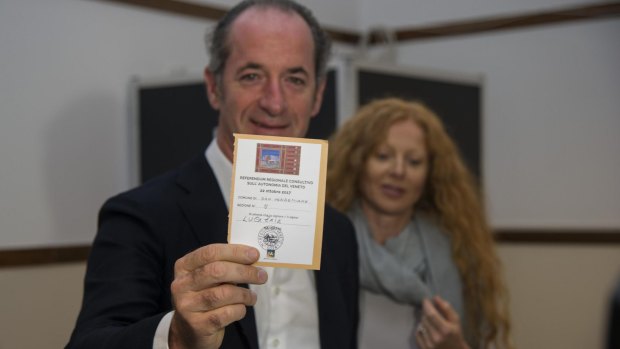 President of Veneto Region, Luca Zaia, shows his ballot at a polling station in San Vendemiano on Sunday.