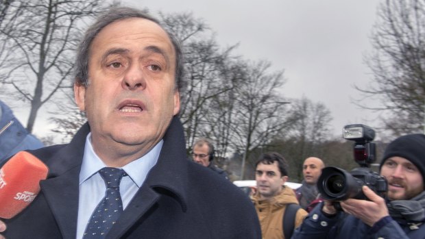 Platini arrives at the FIFA headquarters  in Zurich.