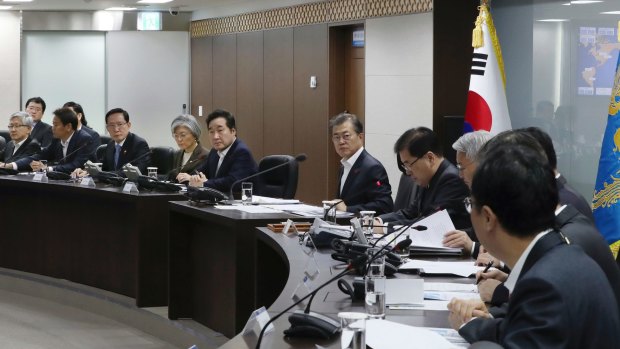 South Korean President Moon Jae-in, centre, presides over a meeting of the National Security Council to discuss the latest missile launch on Wednesday.