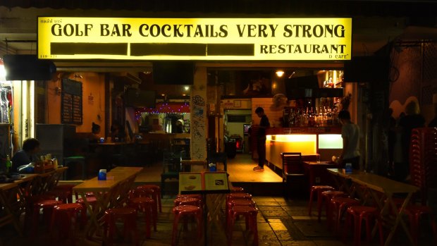 An almost empty bar on the silent Khao San Road in central Bangkok, an area that has become a world famous spot for backpackers. For 30 days  music, parties and any celebrations are banned as a mark of respect for the passing of the King. 