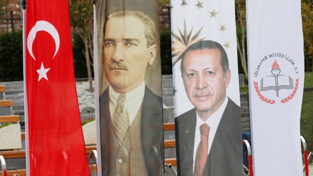 Banners with pictures of modern Turkey's founder Ataturk and Turkish President Tayyip Erdogan adorn the opening ceremony of Recep Tayyip Erdogan Imam Hatip School in Istanbul, Turkey.
