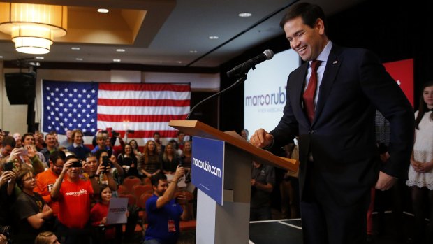 Florida Senator Marco Rubio smiles while speaking at a caucus night rally in Des Moines, Iowa. 