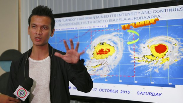 Forecaster Aldczar Aurelio speaks at a media briefing in Quezon City on Typhoon Koppu (known in the Philippines as "Lando").