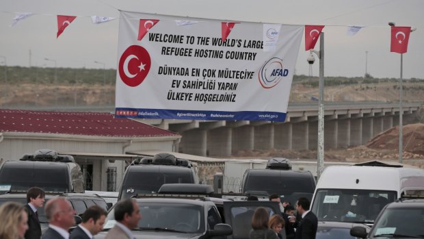 Pointed message: A banner at the Nizip refugee camp reminds European Union officials that Turkey is playing host to millions of refugees from the Syrian conflict.